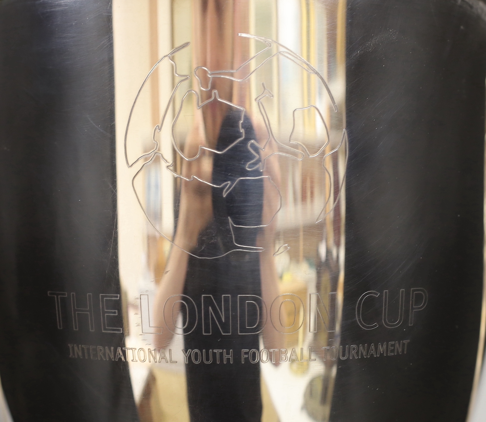‘The London Cup’, a large silver plated twin handled trophy and cover on circular wooden stand, 70cm high